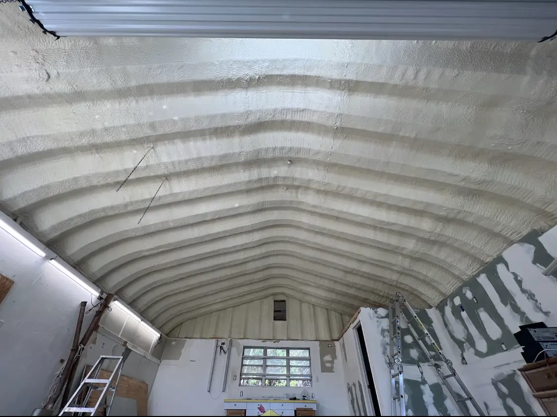 Spray polyurethane foam applied to the underside of a metal roof deck in Coto de Caza